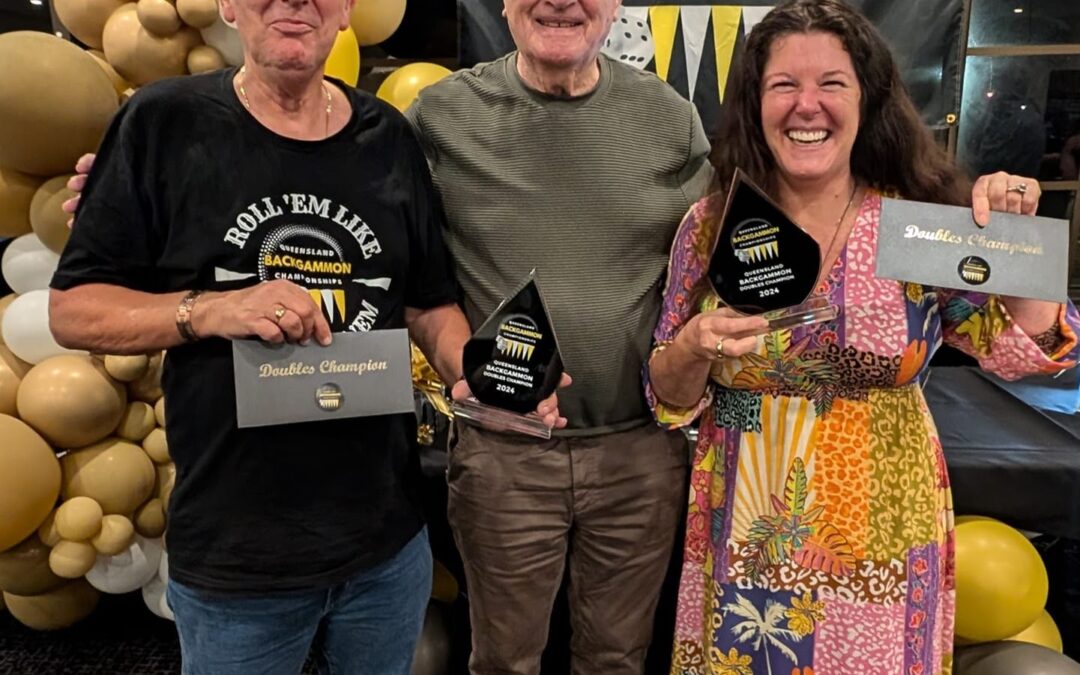 3 people, two of whom have been presented with trophies